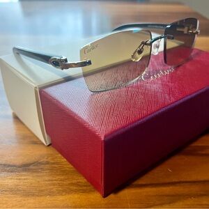 Cartier Rimless Sunglasses with Black Buffalo arms and Silver trim.